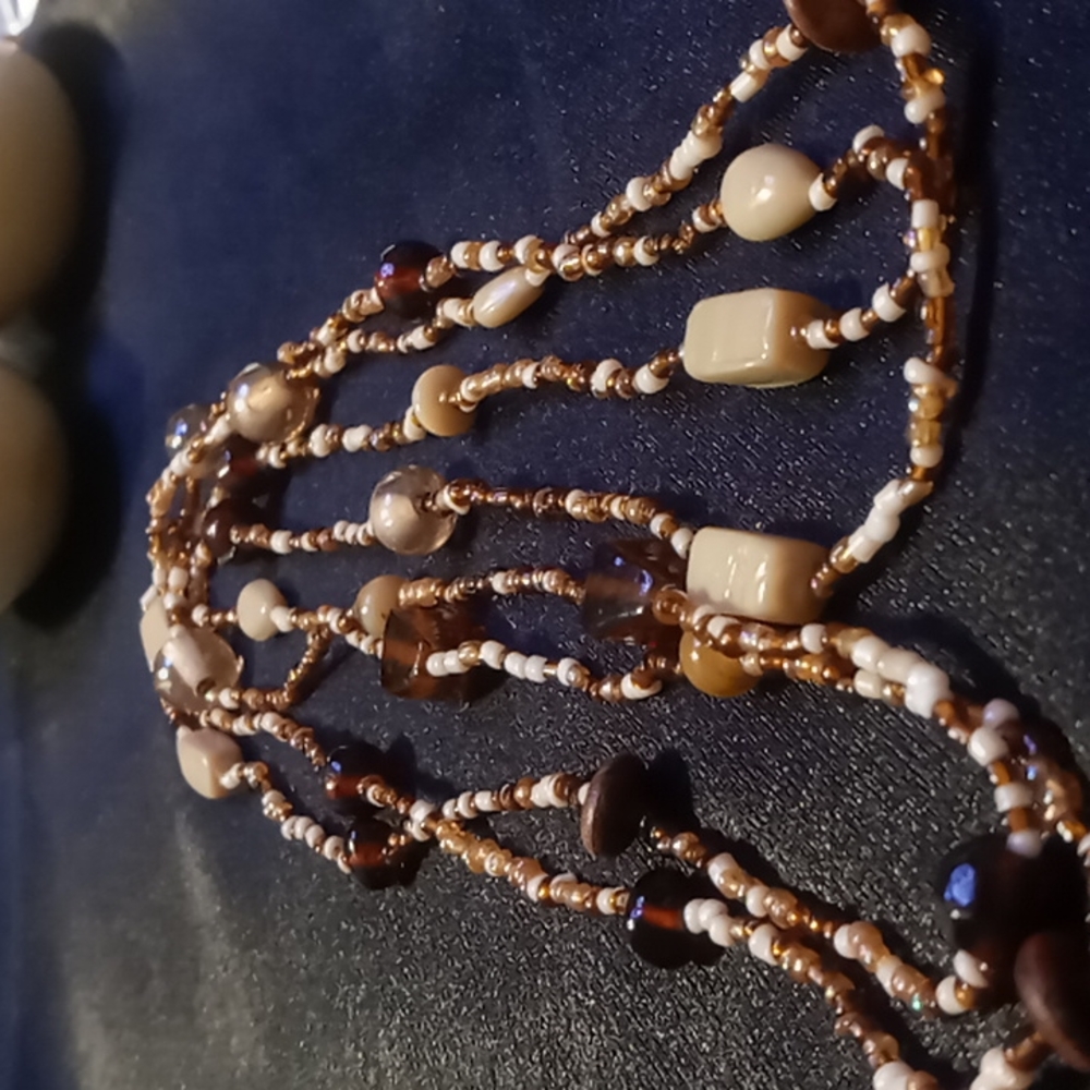 46 inches of glass and Wooden bead necklaces.